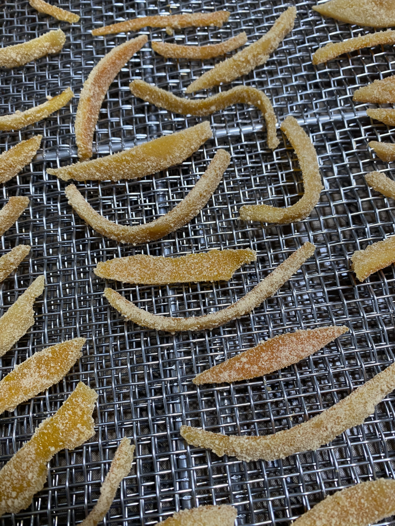Honey-candied orange peels after being coated in maple sugar. 