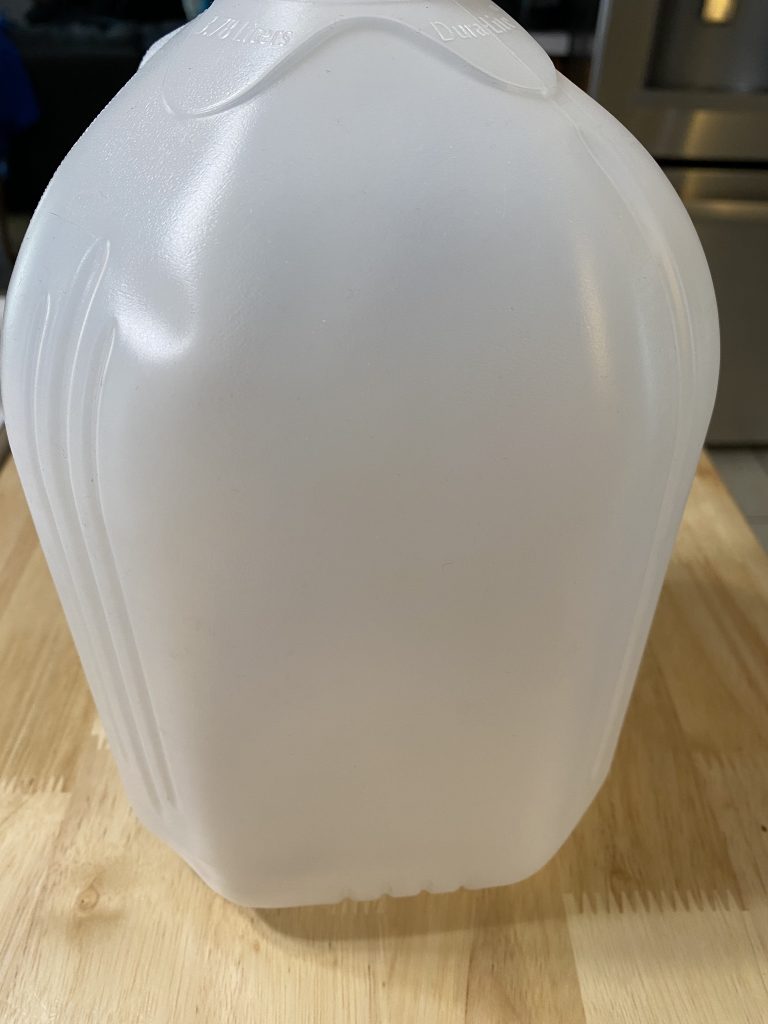 Type of jug used, must be somewhat transparent to act as a mini greenhouse. 