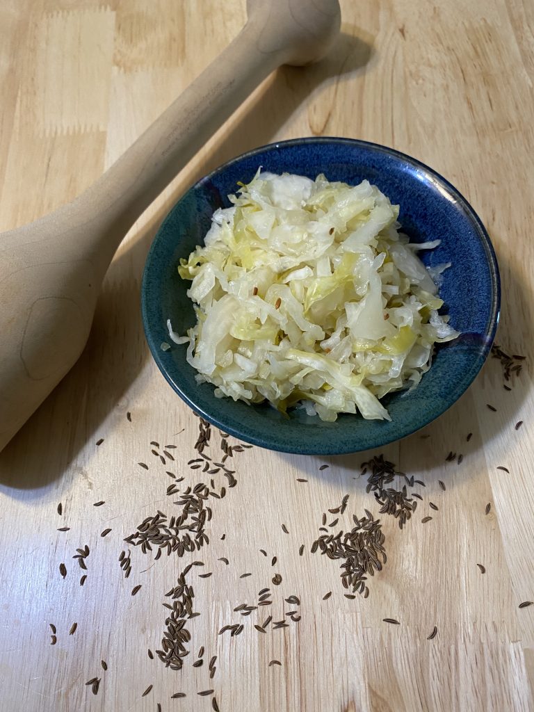 This sauerkraut was fermented in a crock for eight weeks.  Crunchy, sour, delicious, just cabbage, salt, and caraway seeds. 