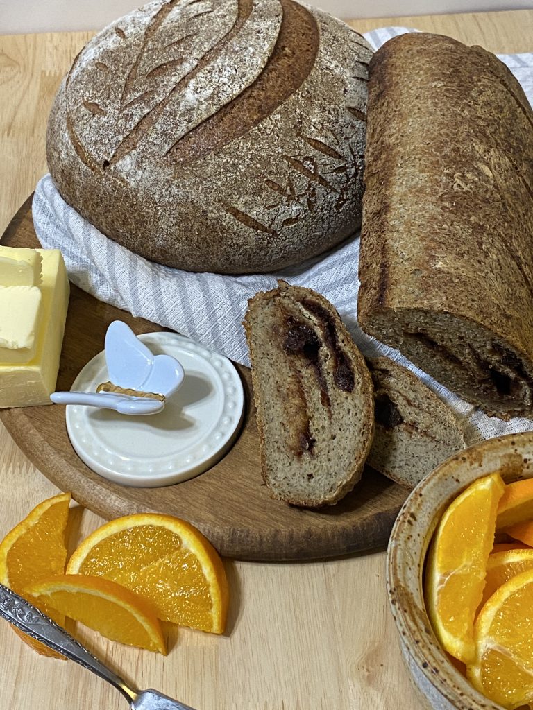 Gluten-free Sourdough bread. The standard shaped loaf has a cinnamon-raisin swirl